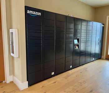 A row of amazon branded storage units are lined up in a room.