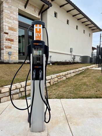 A charging station for electric vehicles is located outside a building.