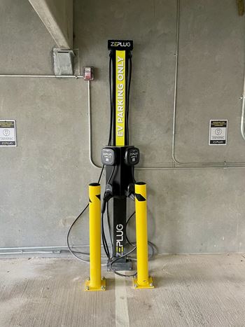 Electric vehicle charging station in parking garage