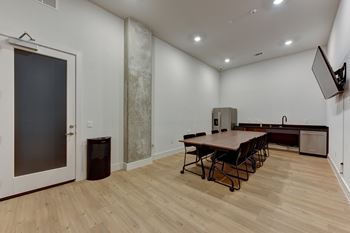 Community room with dining table and kitchenette