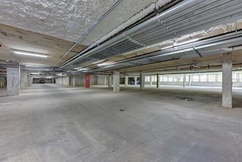 Underground parking garage with concrete columns and ductwork 1