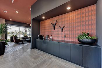 Lobby entrance with patterned accent wall and console table