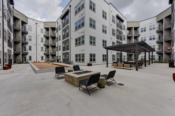 Courtyard fire pit with seating and pergola shade