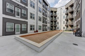 Courtyard with framed gravel area and concrete walkway