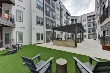 Outdoor courtyard with seating area and covered pergola