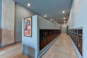 Package room with bronze mailboxes and bulletin board