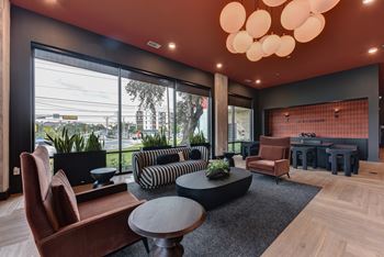 Modern lobby with striped sofa and large windows