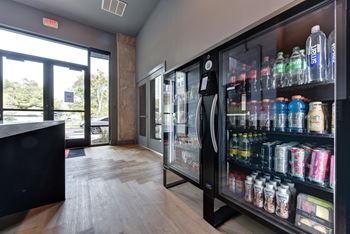 Beverage cooler near building entrance with glass doors