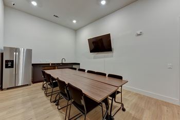 Community room with kitchenette and dining table