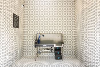 A stainless steel barbecue in the corner of a room