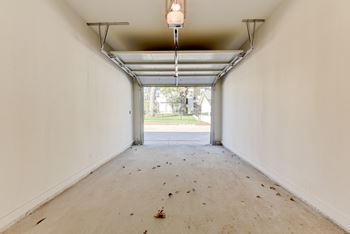 A long hallway with a door at the end.