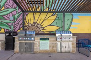 Austin apartment for rent - A BBQ grill with a sign that says "Complimentary" on it.