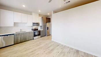 Open kitchen with modern two tone cabinets