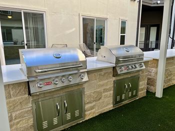 Outdoor kitchen with dual builtin stainless steel grills