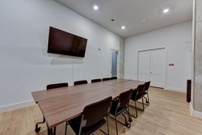 Austin apartment for rent - Conference room with wall mounted tv at Matador Apartments, Austin, TX 78745