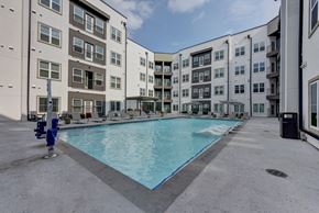 Austin apartment for rent - Courtyard pool surrounded by modern apartment buildings at Matador Apartments, Austin, TX 78745