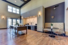 Austin apartment for rent - A dining room with a wooden table and chairs at Bridge at Speyside Apartments, Austin, Texas