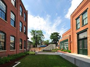 Baltimore apartment for rent - A courtyard surrounded by red brick buildings.