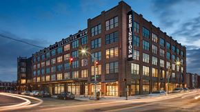 Baltimore apartment for rent - A large brick building with the word "REIMINGTON" on the side.