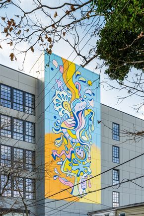 Baltimore apartment for rent - A large mural of a colorful abstract design on a building.