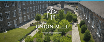 Baltimore apartment for rent - A view of a courtyard surrounded by buildings at Union Mill.