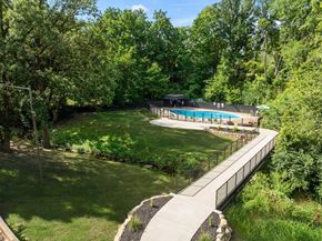 Peoria apartment for rent - A pool surrounded by a green forest
