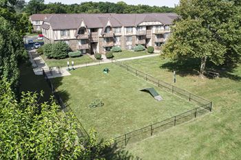 An aerial view of the backyard of an apartment complex