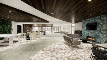 Henrico apartment for rent - A modern living room with a wooden ceiling and a stone fireplace.