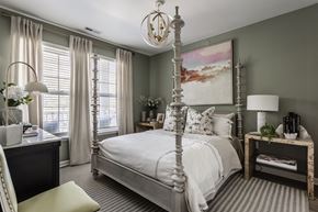 Carmel apartment for rent - a bedroom with a white bed and a painting on the wall at Alexandria of Carmel Apartments, Carmel, IN, 46032