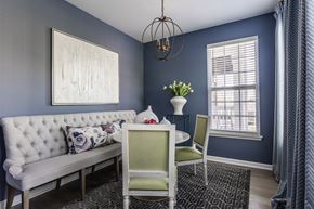 Carmel apartment for rent - a flexspace with blue walls and a white couch and a table with two chairs at Alexandria of Carmel Apartments, Indiana, 46032