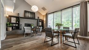 Miamisburg apartment for rent - A modern dining room with a glass table and chairs
