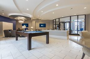 Carmel apartment for rent - a lounge with a pool table TVs and work stations in Carmel, IN, 46032