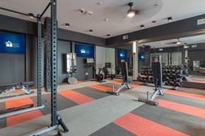 Carmel apartment for rent - a fitness room with weights and exercise equipment at Avant Apartments in Carmel, 46032