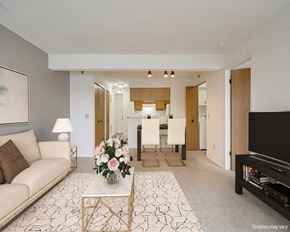 Novi apartment for rent - Azalea Layout Model Living Room with Kitchen View at Portsmouth Apartments, Michigan 48377