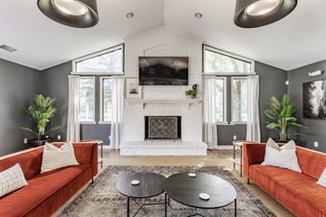 Indianapolis apartment for rent - A living room with a fireplace and a television mounted above it.