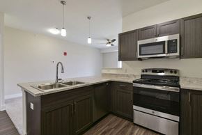 Rogers apartment for rent - Kitchen with Breakfast Bar at Dodson Pointe Apartment Homes, Rogers, AR, 72758