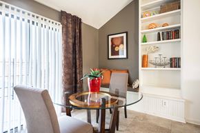 Indianapolis apartment for rent - A dining room with a glass table and chairs