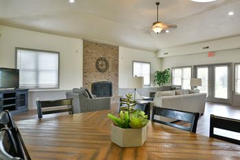 The view of a living room and dining room with a table and chairs