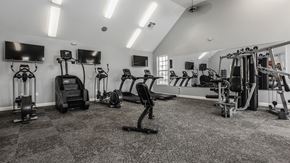 Columbus apartment for rent - a gym with cardio machines and televisions in a building at The Avenue at Polaris Apartments, Columbus, OH