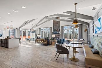 A clubhouse filled with furniture and a large window