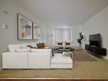 Grand Blanc apartment for rent - a living room with a white couch and a television