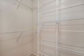 Walk-in closet with wardrobe organizers