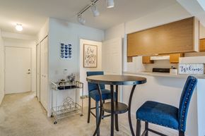 Macomb apartment for rent - A dining area with a table and chairs  at Northport Apartments, Macomb, MI, 48044