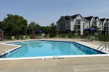 Large outdoor swimming pool with sundeck