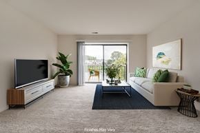 Westland apartment for rent - a living room with a couch and coffee table at The Landings Apartments, Westland, MI
