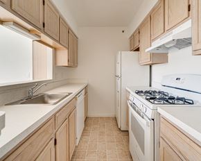 Clinton Twp apartment for rent - Lily Layout Model White Kitchen Appliances at The Harbours Apartments, 48038