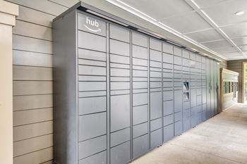 A long row of amazon storage units are lined up in a hallway
