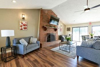 Inviting clubhouse with fireplace wall
