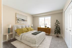 Farmington Hills apartment for rent - a bedroom with a large bed and a large window at Cordoba Apartments, Farmington Hills, MI, 48334