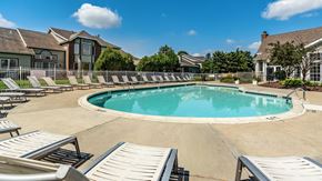 Crown Point apartment for rent - A large outdoor swimming pool surrounded by sun loungers at Mallard Bay Apartments, Crown Point, Indiana